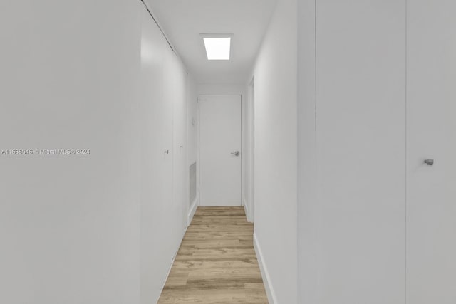 corridor featuring light hardwood / wood-style flooring