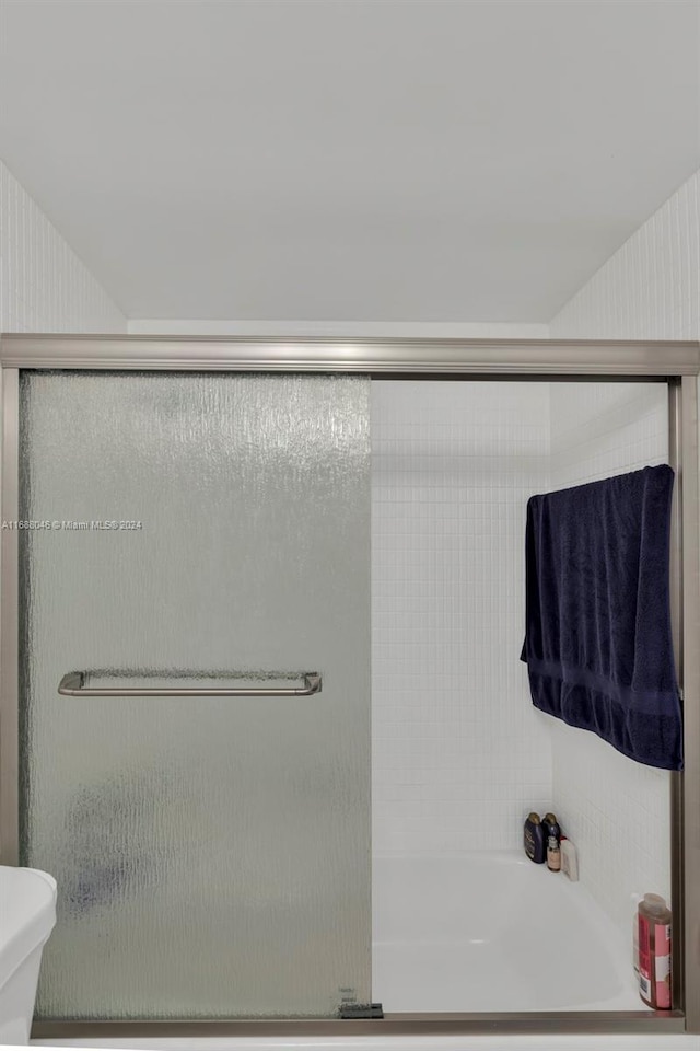 bathroom with toilet and separate shower and tub