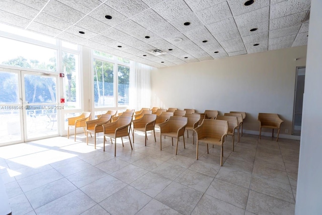 interior space featuring a drop ceiling