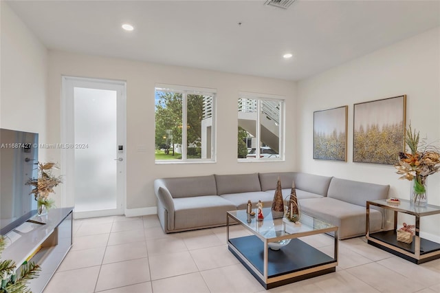 living room with light tile patterned flooring