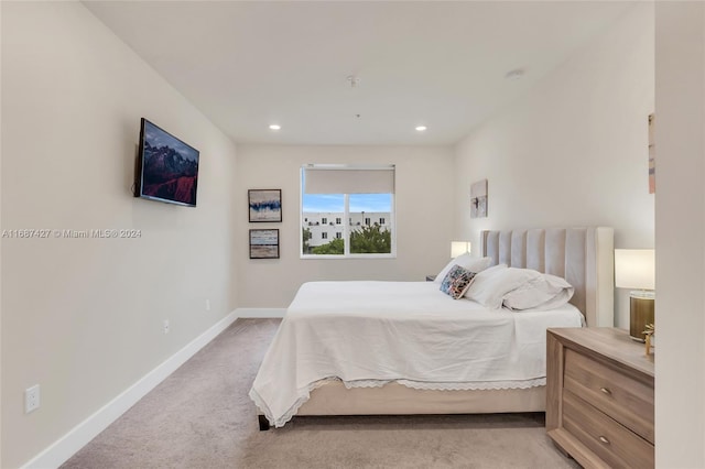 6425 NW 103rd Pl Unit 102, Doral, FL 33178 - bedroom featuring light carpet, baseboards, and recessed lighting