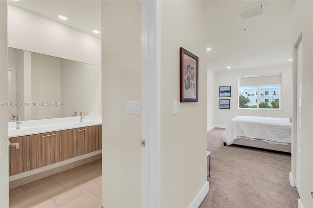 6425 NW 103rd Pl Unit 102, Doral, FL 33178 - hallway featuring baseboards, light colored carpet, a sink, and recessed lighting