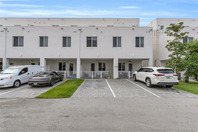 6425 NW 103rd Pl Unit 102, Doral, FL 33178 - view of property featuring uncovered parking