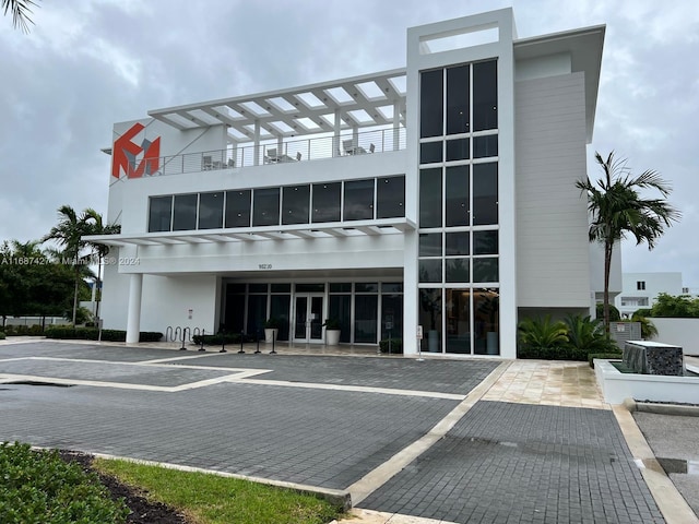 6425 NW 103rd Pl Unit 102, Doral, FL 33178 - view of property featuring uncovered parking