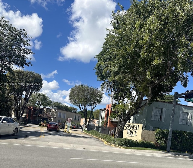 view of road with curbs, sidewalks, and a residential view