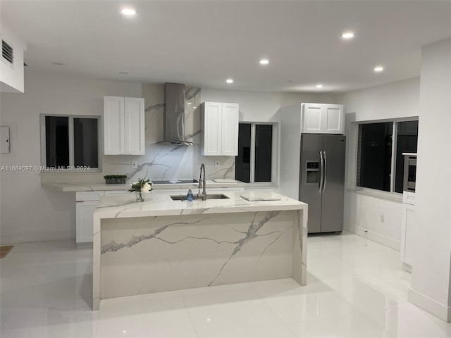 1201 Marseille Dr Unit 17, Miami Beach, FL 33141 - kitchen with stainless steel appliances, wall chimney range hood, a sink, recessed lighting, and white cabinetry