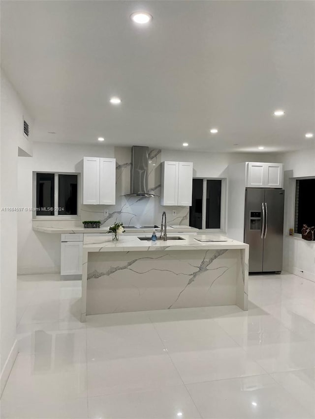 1201 Marseille Dr Unit 17, Miami Beach, FL 33141 - kitchen featuring stainless steel fridge with ice dispenser, wall chimney exhaust hood, recessed lighting, white cabinetry, and a sink
