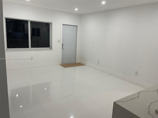 1201 Marseille Dr Unit 17, Miami Beach, FL 33141 - unfurnished room with recessed lighting, baseboards, and tile patterned floors