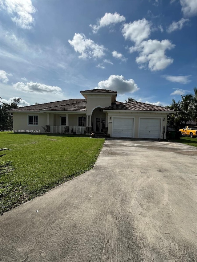 view of front facade with a garage and a front yard