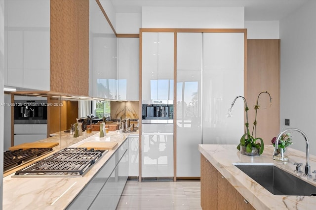 2811 S Bayshore Dr Unit 4C, Miami, FL 33133 - kitchen featuring a sink, appliances with stainless steel finishes, and light stone countertops