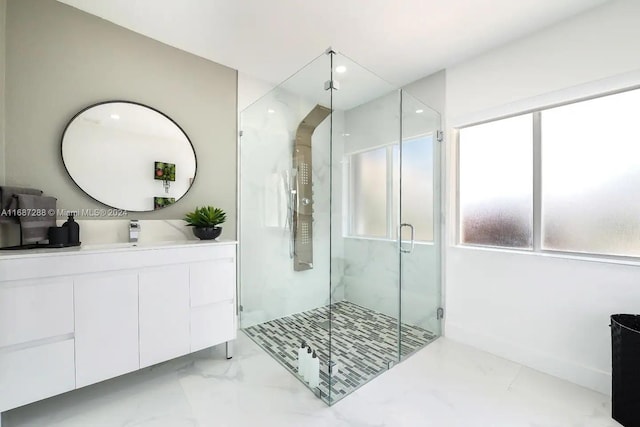 bathroom featuring walk in shower and vanity