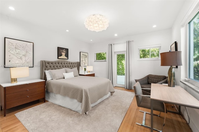 bedroom featuring light wood-type flooring and multiple windows