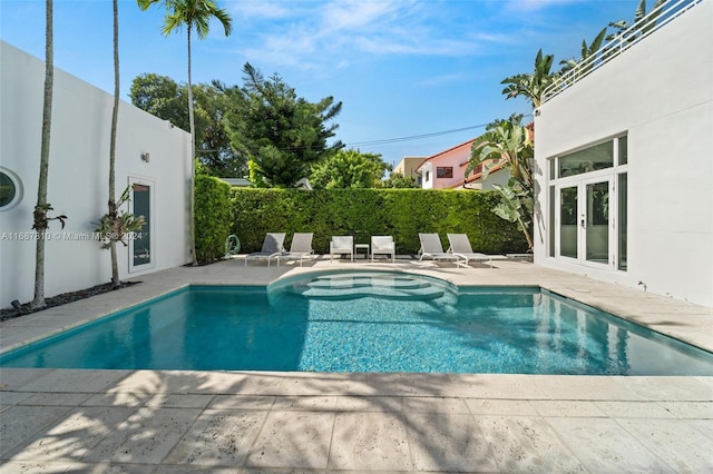 view of swimming pool featuring a patio