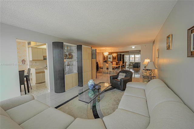 living room featuring light hardwood / wood-style floors and a textured ceiling