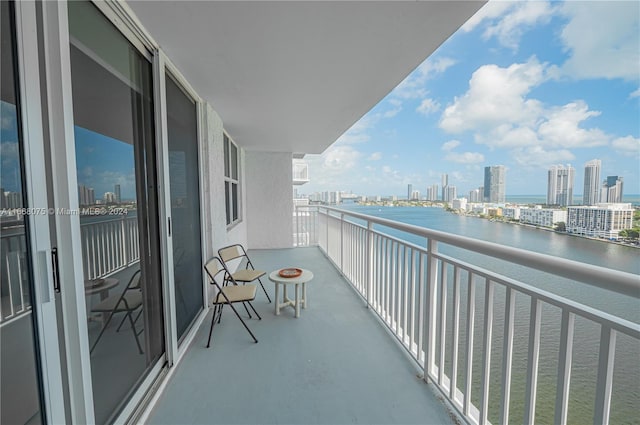 balcony featuring a water view