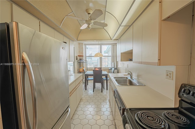 kitchen with stainless steel appliances, sink, ceiling fan, and light tile patterned floors