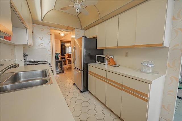 kitchen featuring white cabinetry, sink, white appliances, and ceiling fan