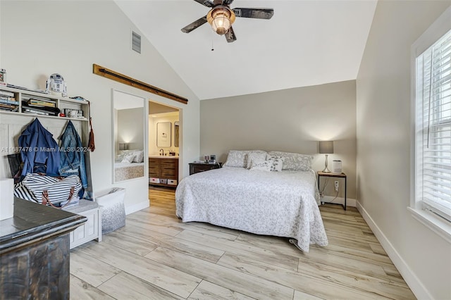 bedroom featuring sink, ensuite bathroom, high vaulted ceiling, ceiling fan, and light wood-type flooring