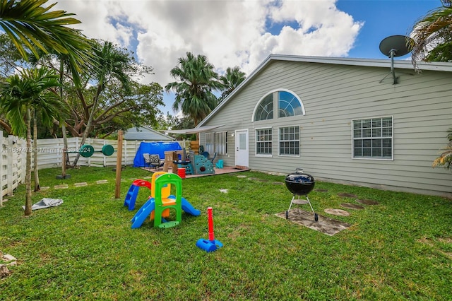 rear view of house with a patio area and a lawn