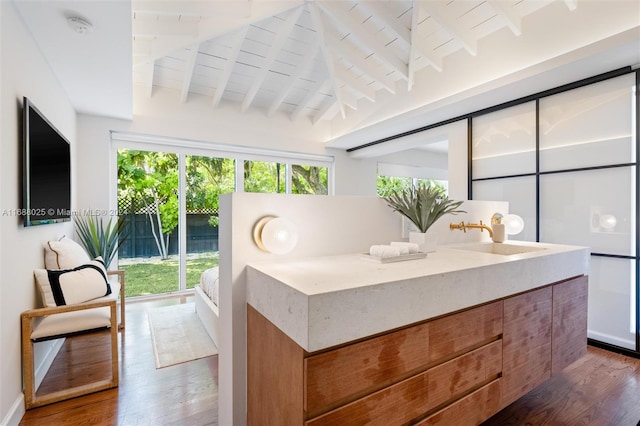 sunroom with wooden ceiling, sink, and lofted ceiling with beams