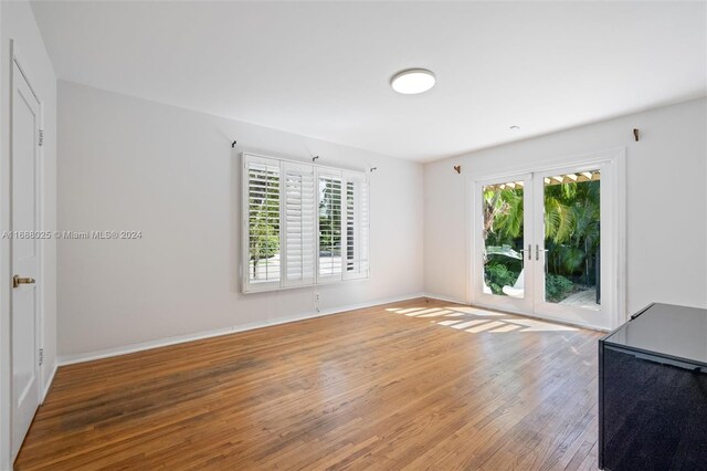 interior space with hardwood / wood-style flooring and french doors