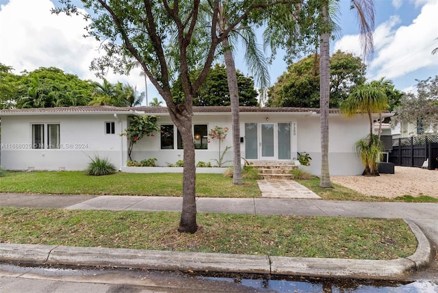 ranch-style home with a front yard