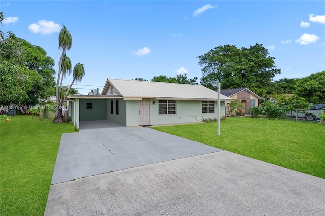 ranch-style home featuring a carport and a front lawn