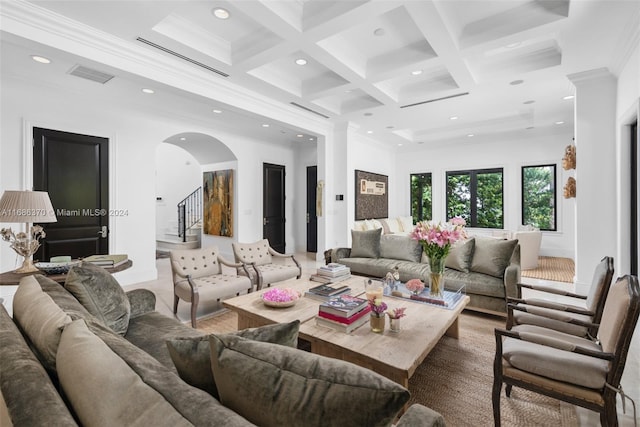 living room with coffered ceiling, beamed ceiling, and ornamental molding