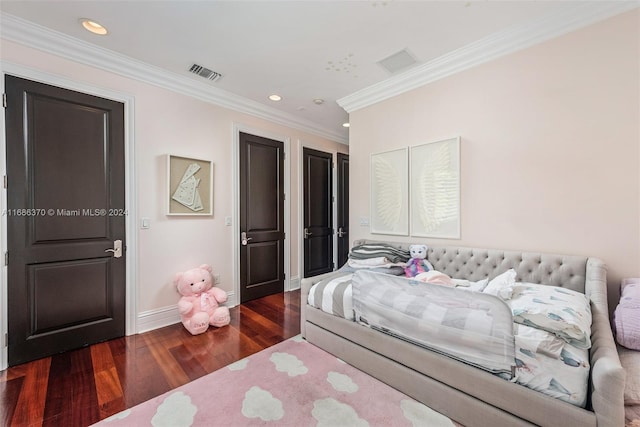 bedroom with dark hardwood / wood-style flooring and ornamental molding