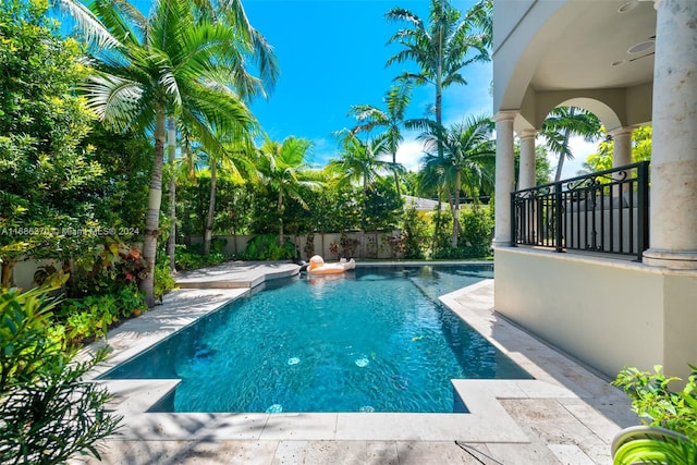 view of swimming pool with a patio area