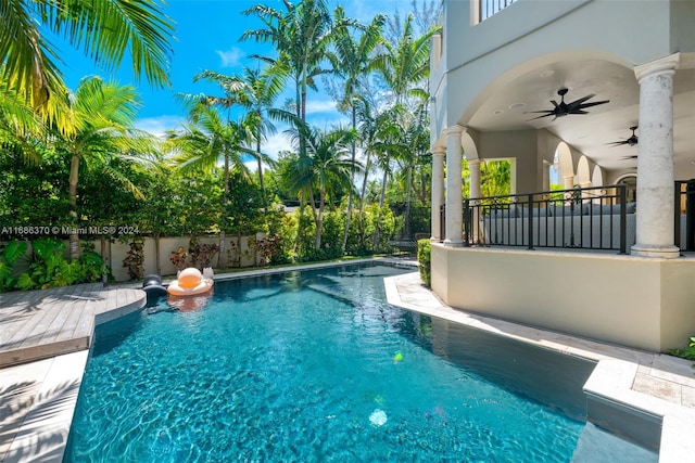 view of swimming pool featuring ceiling fan