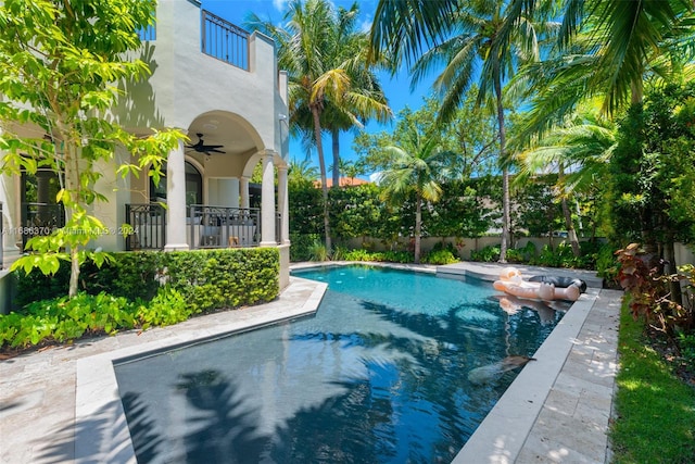 view of pool with ceiling fan