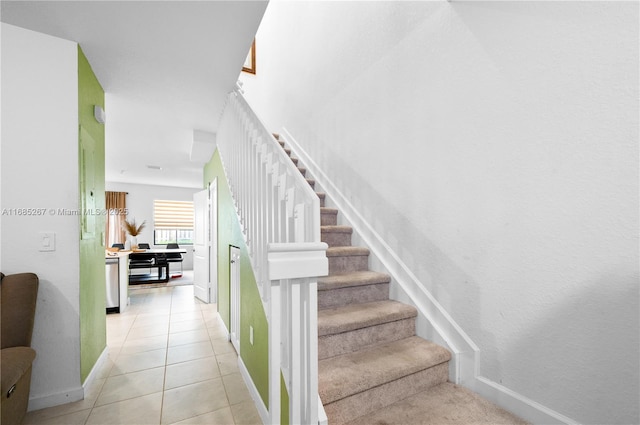 staircase with tile patterned floors