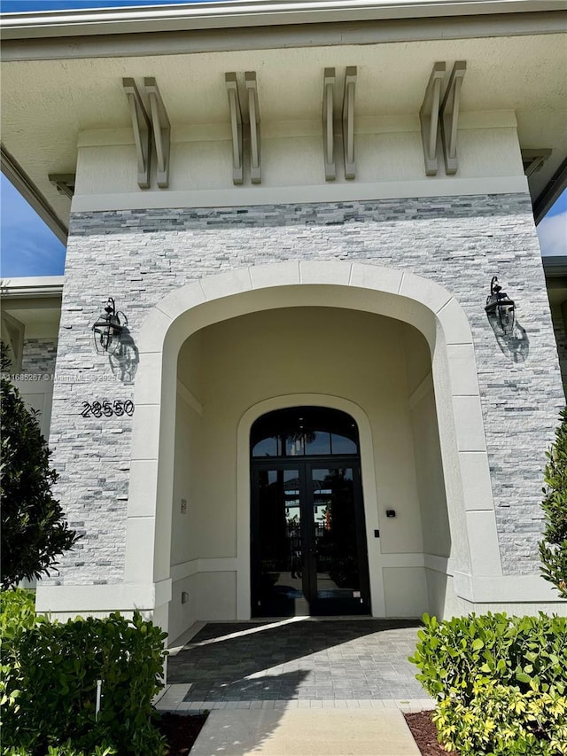 entrance to property featuring french doors