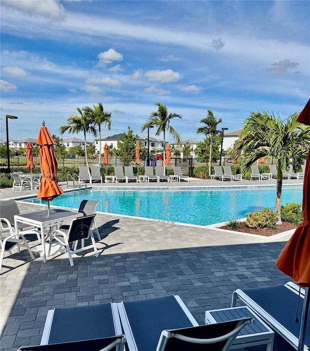 view of swimming pool featuring a patio area