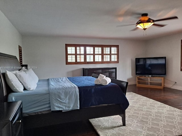 bedroom with hardwood / wood-style floors and ceiling fan