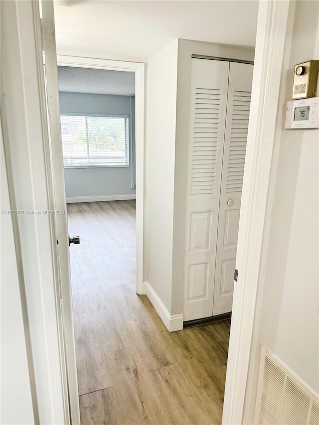 hall featuring light hardwood / wood-style flooring