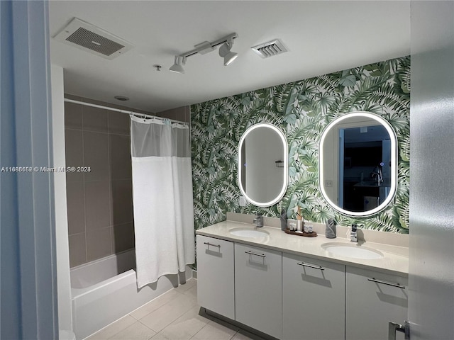 bathroom with vanity, shower / bath combination with curtain, and tile patterned floors