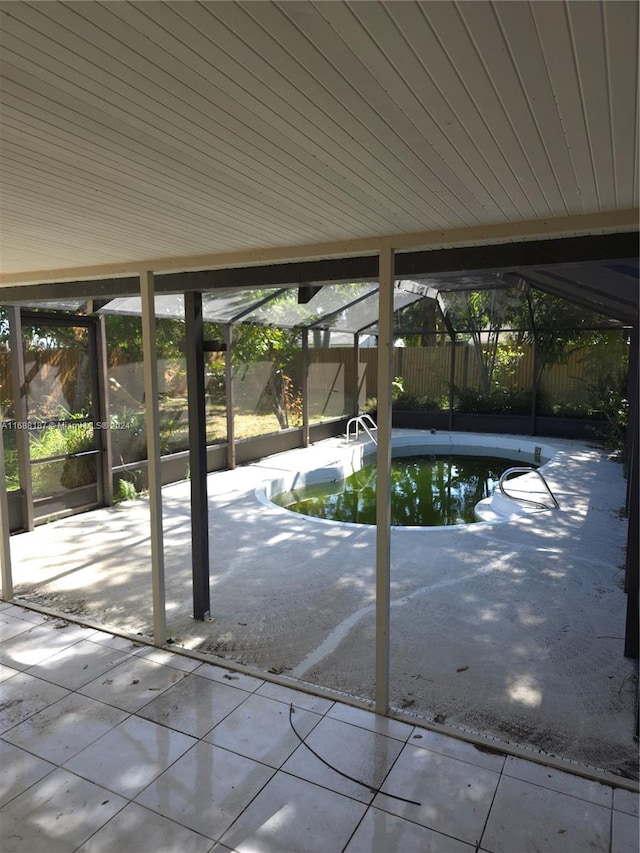 view of patio / terrace with a fenced in pool