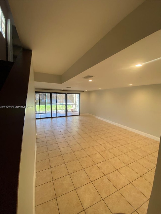 spare room with light tile patterned floors