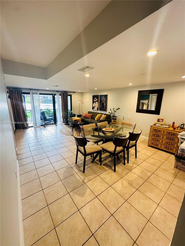 dining area featuring light tile patterned floors