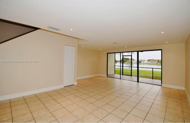 empty room with light tile patterned floors