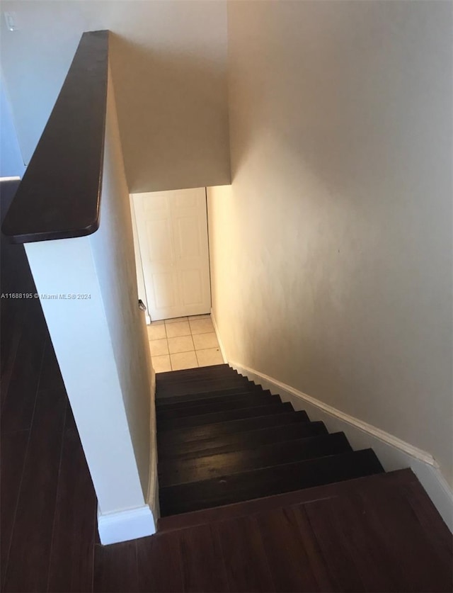 stairs with wood-type flooring