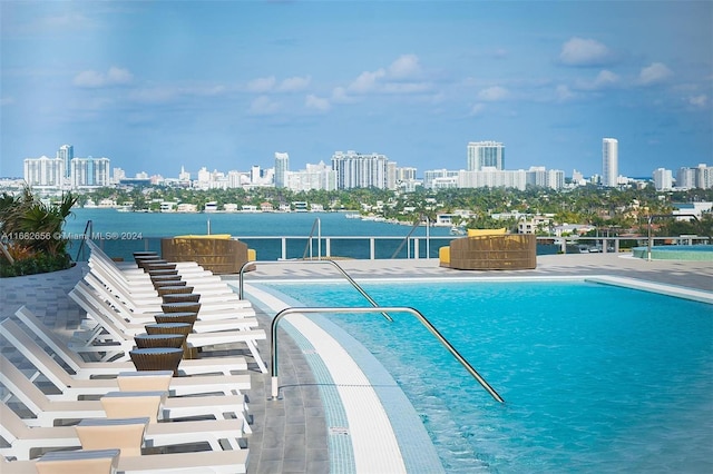 view of pool with a water view