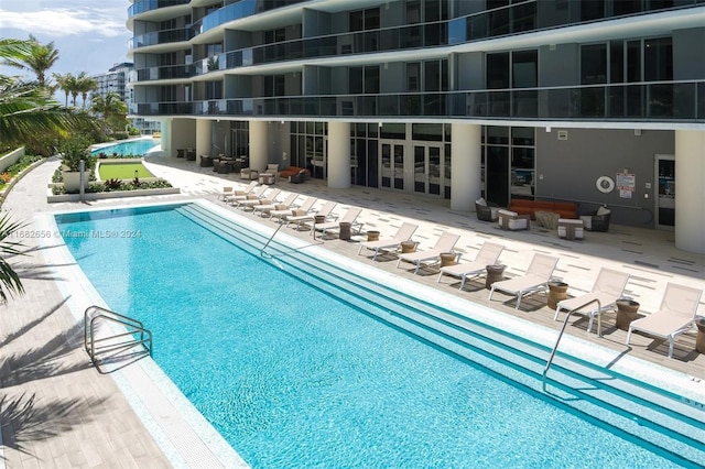 view of swimming pool with a patio