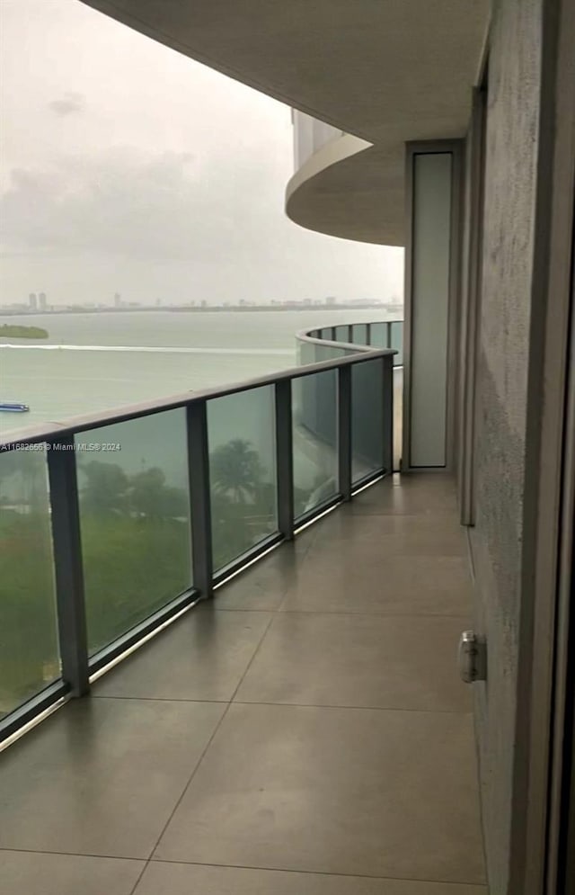 balcony featuring a water view