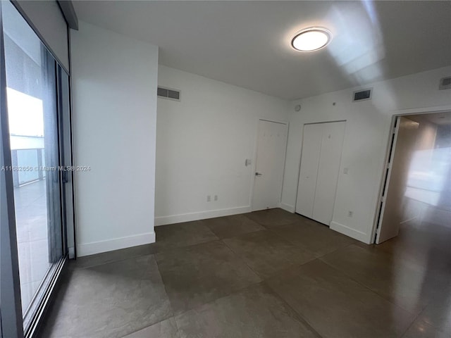 unfurnished bedroom with a closet