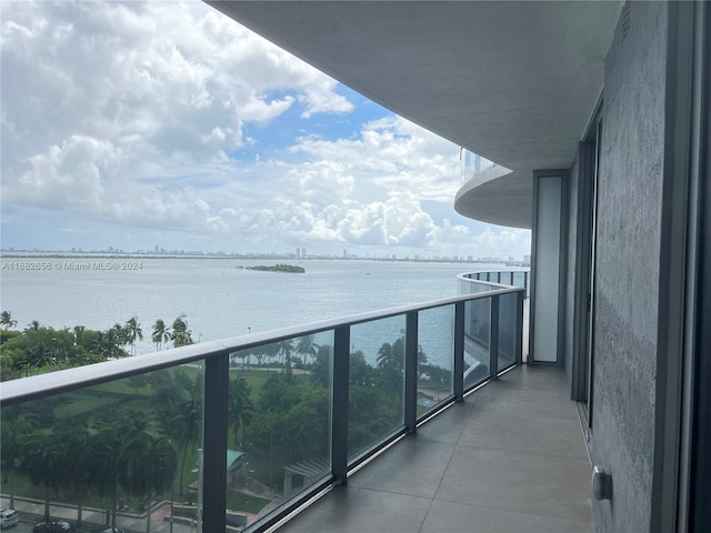 balcony featuring a water view