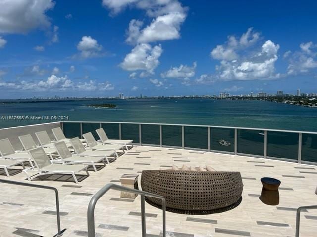 view of patio featuring a water view