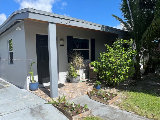 entrance to property with covered porch